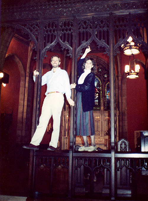 photo of James and Cherry Rhodes on the rood screen, pre-renovation